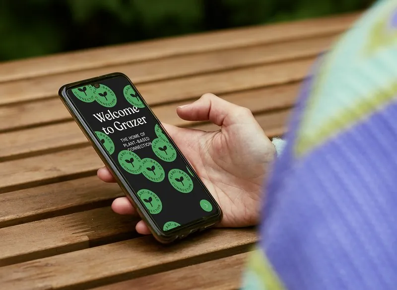 A phone showing the Grazer app